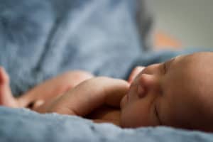 Sleeping newborn wrapped in a blanket